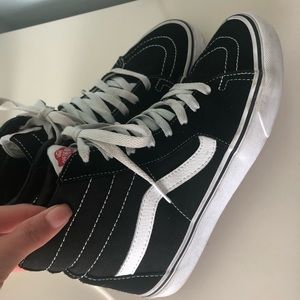 Black and white high top vans